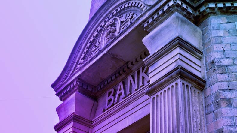 Image of a column building with the word bank on it 
